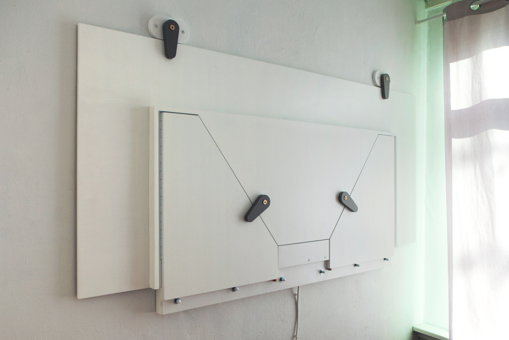 Folding table was made for a vey small room to be used as a standing working tabel. The room is also being used as a guest room when the table is folded up.