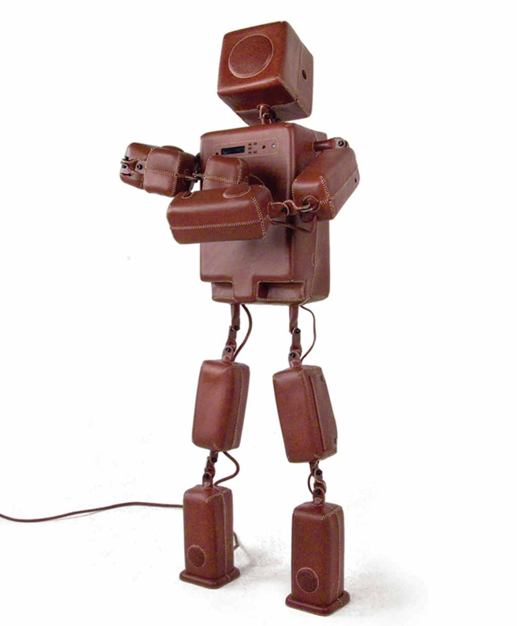 'The Speaker' is an attempt to make the relationship between user and audio system more personal. Instead of music coming out of square boxes or strange shapes, it's coming out of a human form. With the right music 'The Speaker' becomes the singer itself. ( leather, aluminium, electronics, speakers h:163 w:140 d:25 cm )
