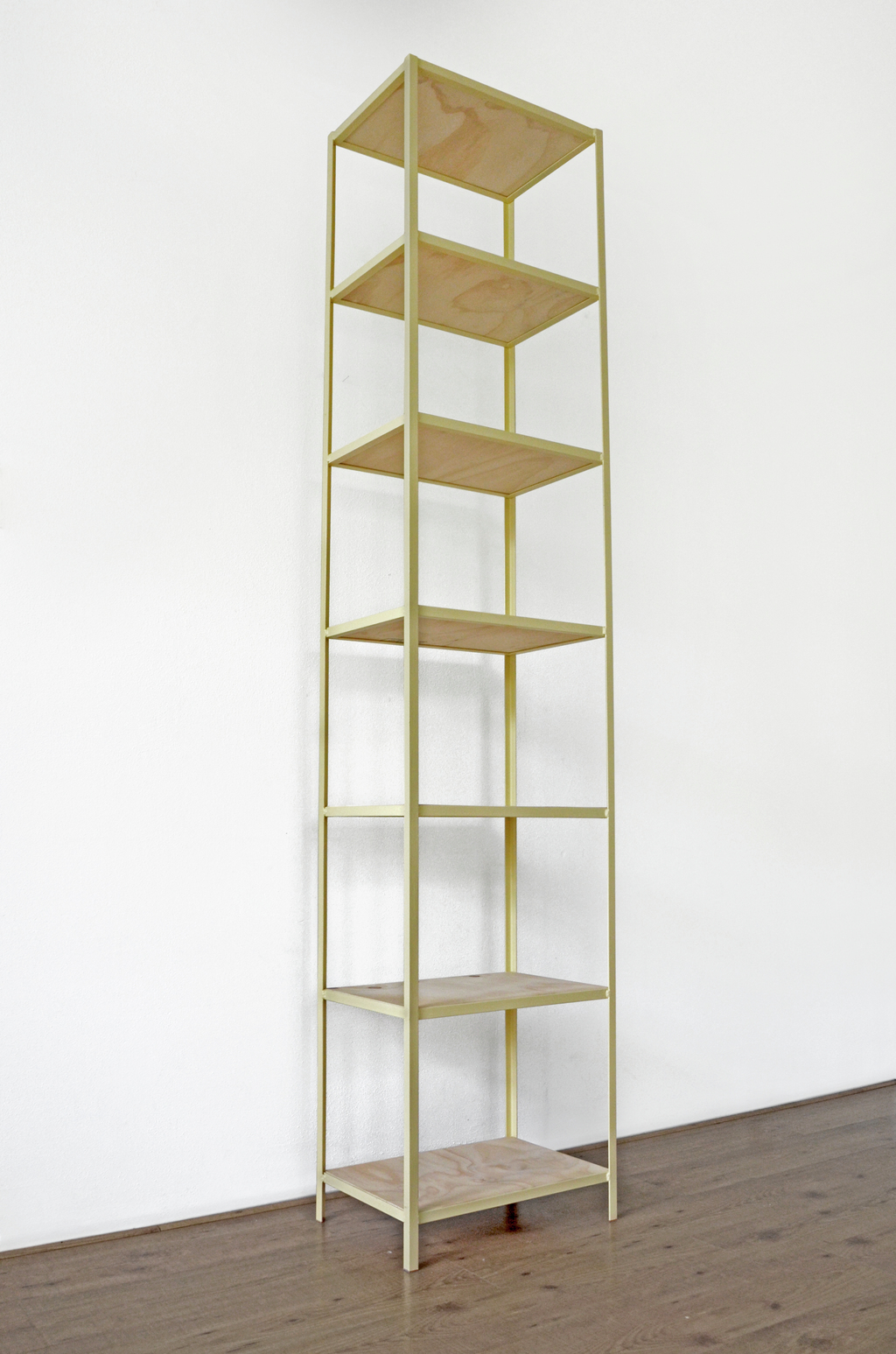 Metal welded frame from L profile with plywood planks. Can be used as a bookshelf or just for storage or display.