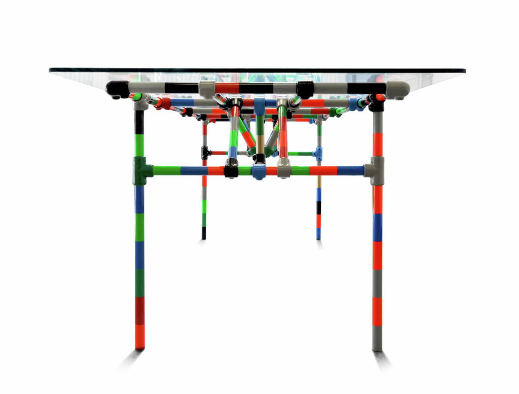 A construction made of steel pipes and clamps that can be assembled in different lengths and width (up to 6 meters) using different color combinations and different tops.
(Tubeklamp®, steel pipes and clamps, 10mm hardened glass | h:72 w:250 d:85 cm 
